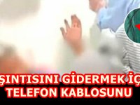 KAŞINTISINI GİDERMEK İÇİN TELEFON KABLOSUNU